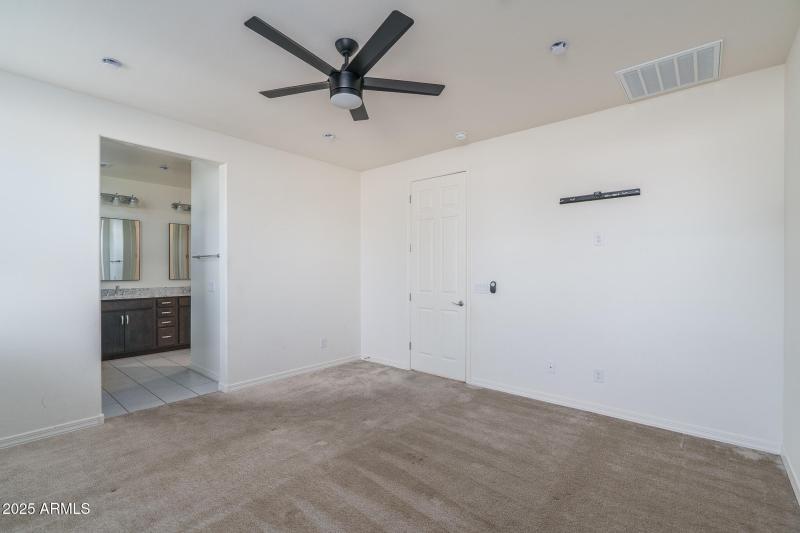 11) PRIMARY BEDROOM
