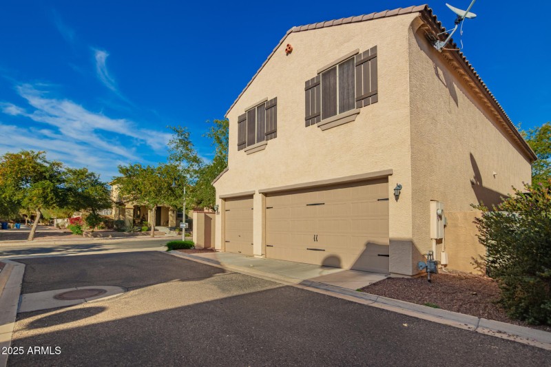 Back of home - 3 car garage