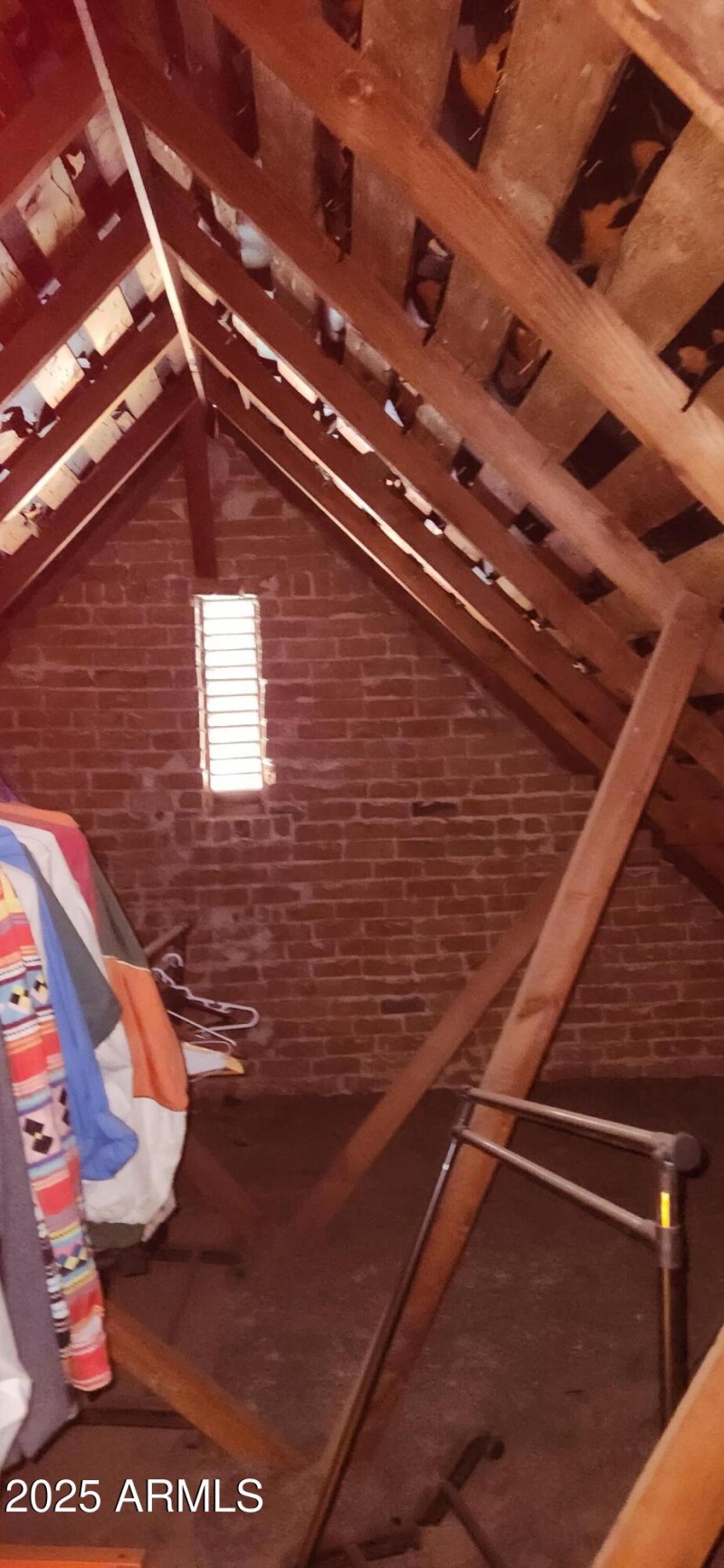 Attic with original brick wall