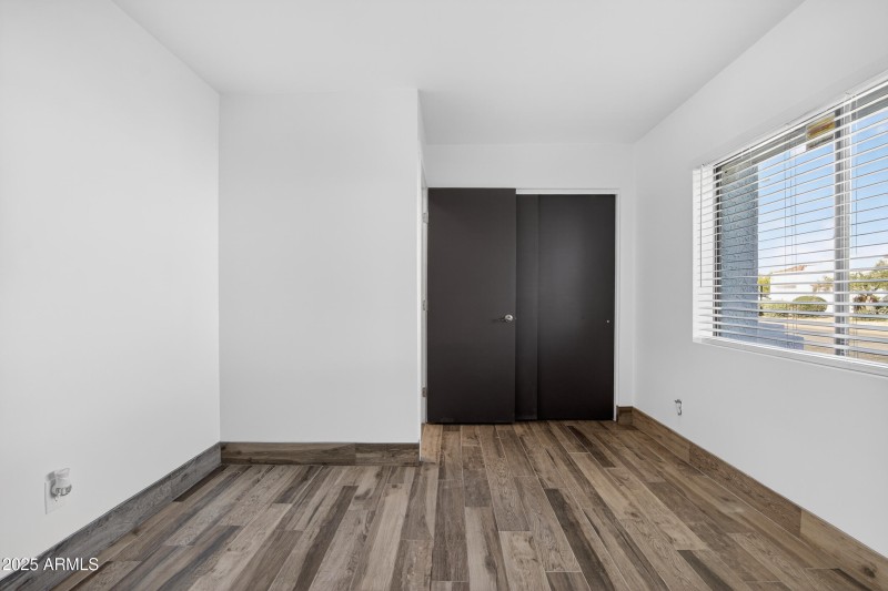 Guest Bedroom with Wood-Look Flooring