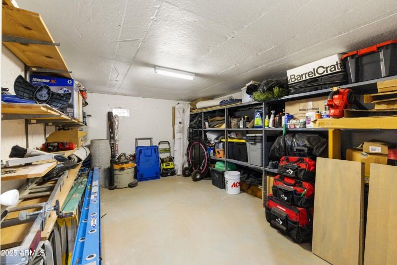 storage area accessed by garage stairs