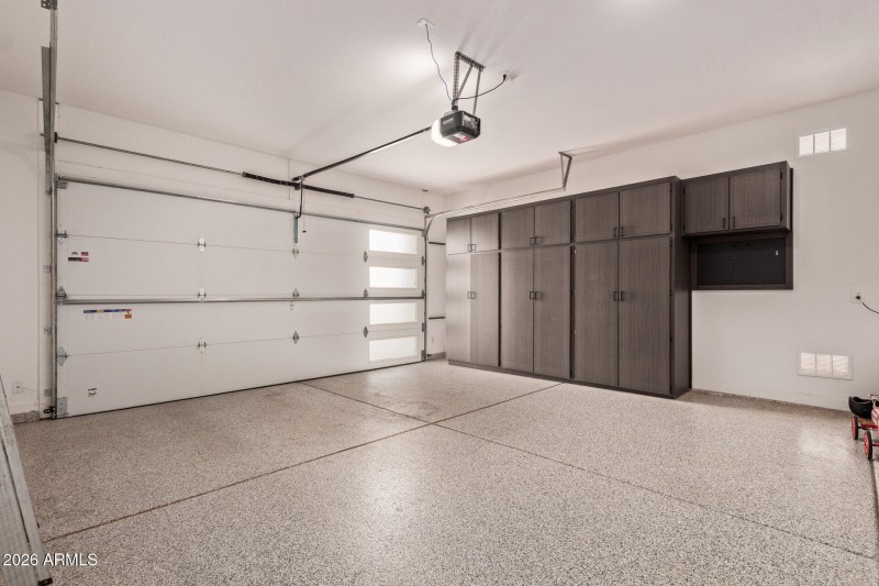 garage w/custom cabinets