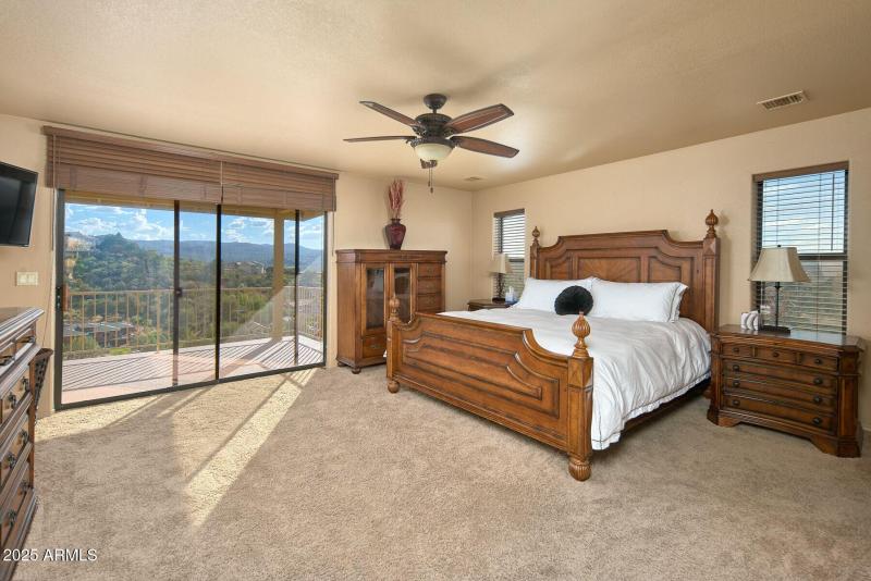 Primary Bedroom with view off balcony