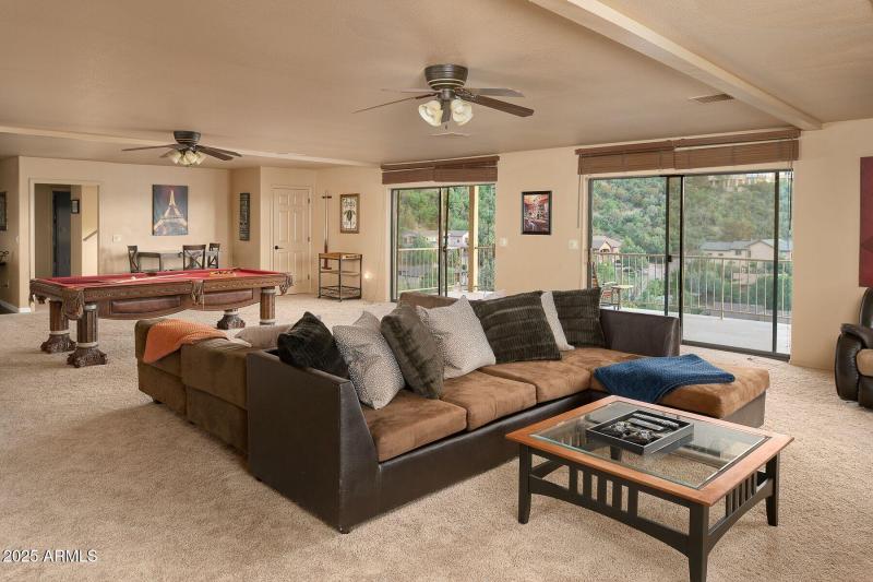 Dwn stairs couch and pool table