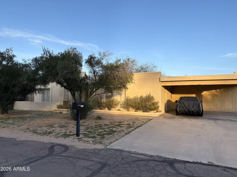 Carport front of house_1007 E Village Ci