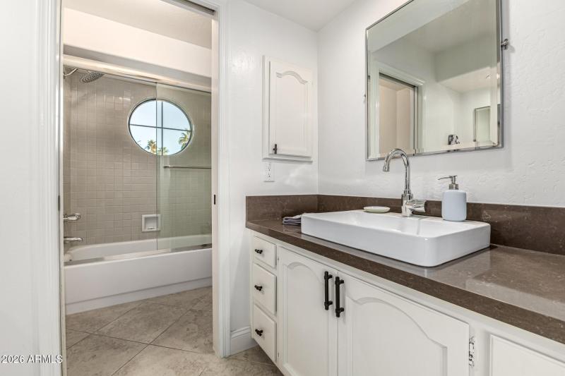 Full bath with separate shower and bath