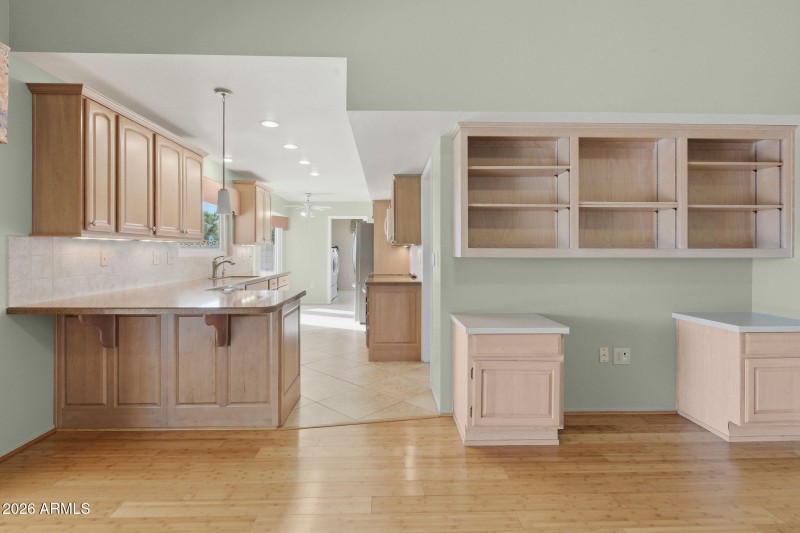Built Ins and Eat In Countertop Kitchen