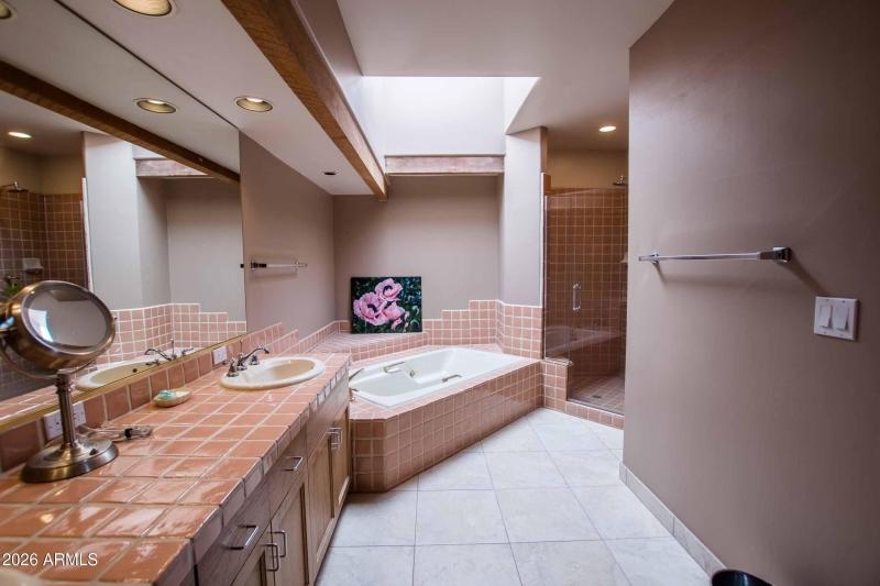 master bath with dual vanities shower an