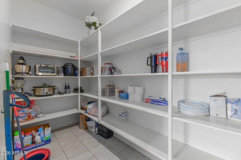 Walk-in pantry with built-in shelving