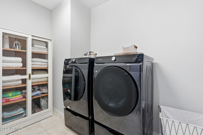 Separate Laundry room, cabinet conveys