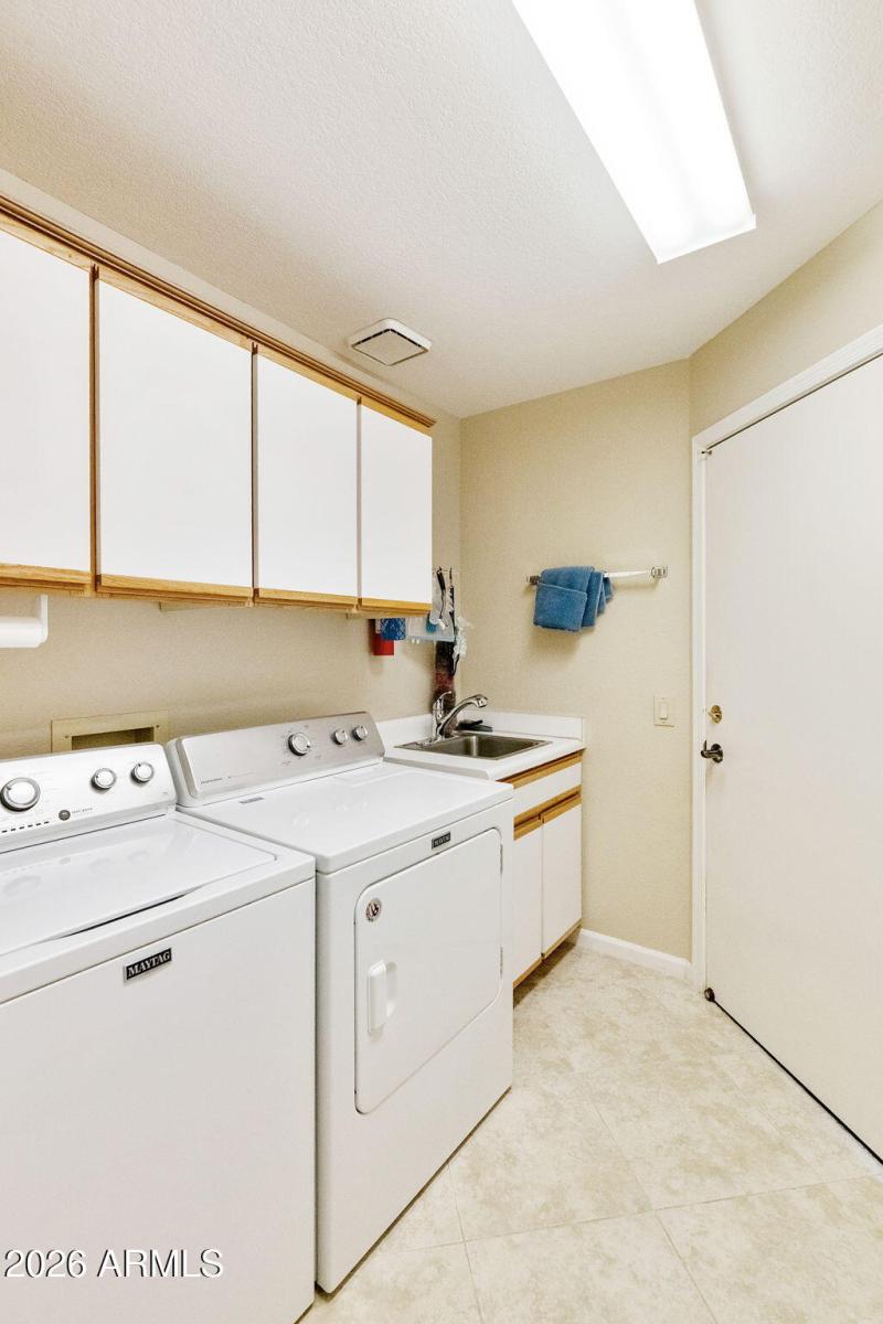 Laundry Room with cabinets/sink