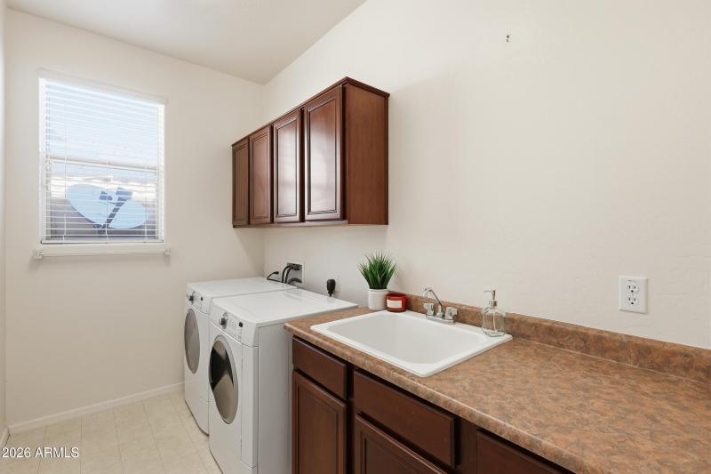 Laundry with sink and storage