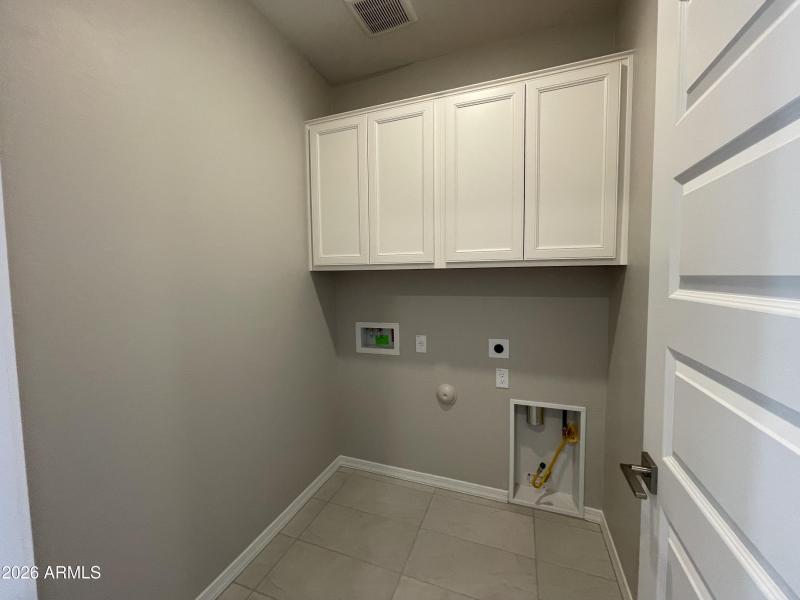 Laundry with cabinets