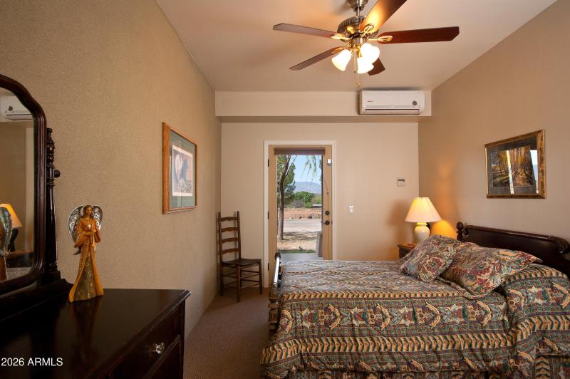 Downstairs Bedroom with Door to Patio