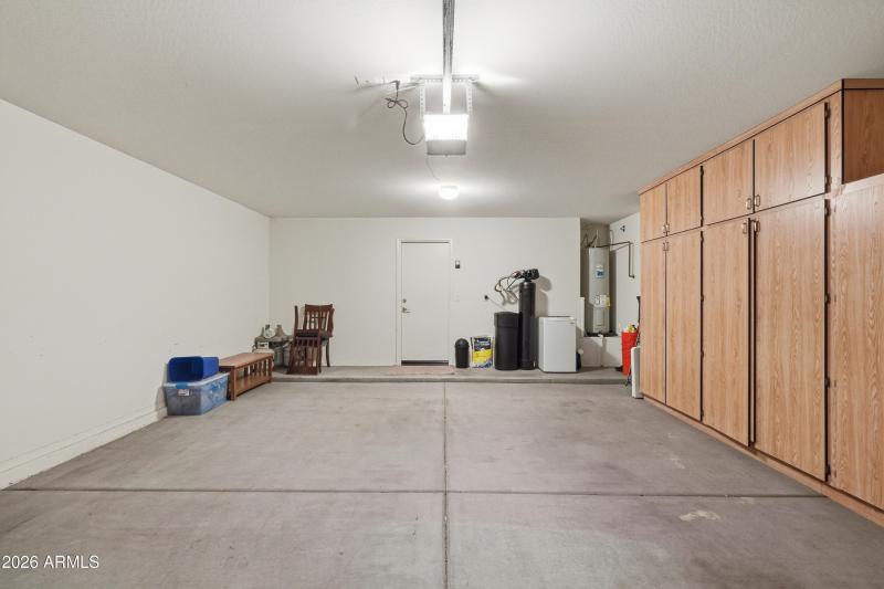 2-Car Garage with Cabinets & Water Soft.