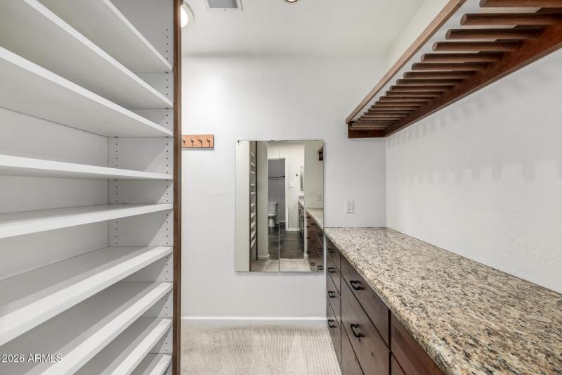 Spacious L-shaped walk-in closet