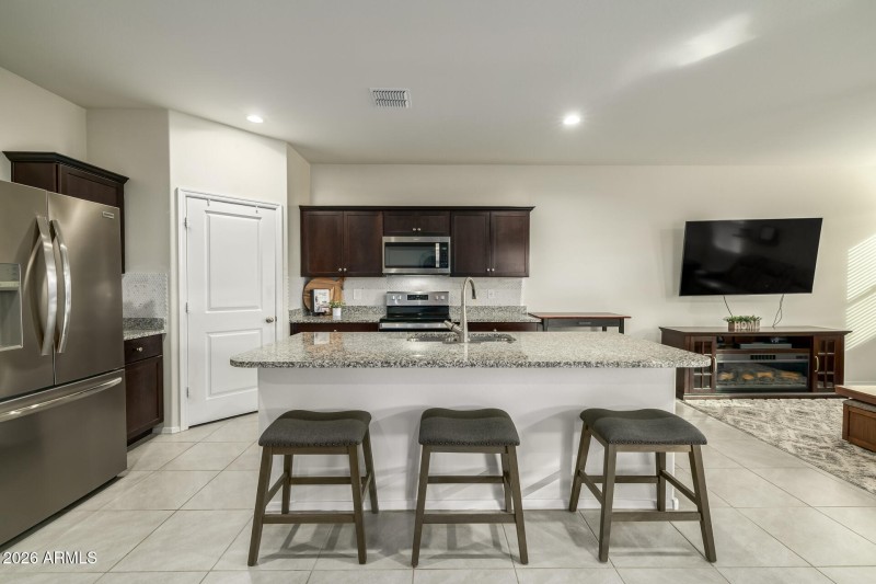 Spacious Kitchen With Granite Counters
