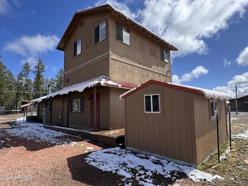 8 - Main house west side & storage shed