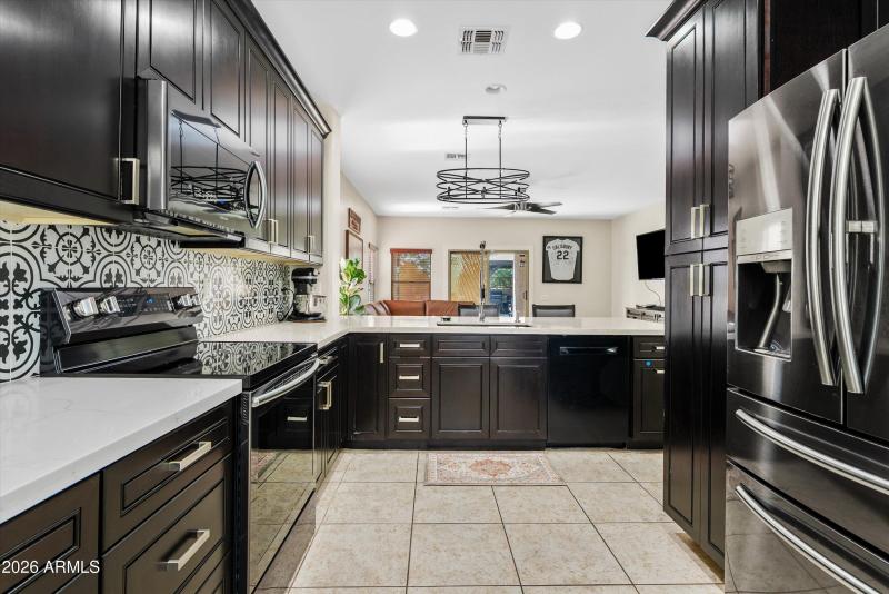 Stainless appliances, custom backsplash