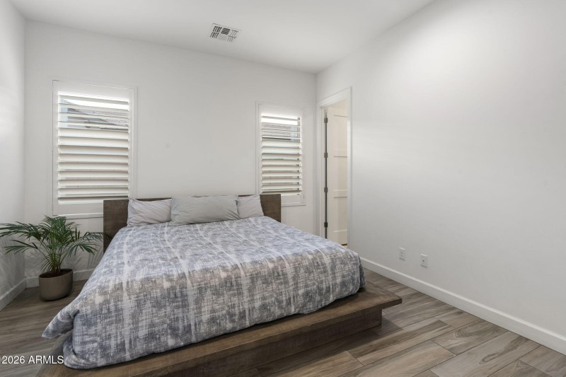 Bedroom w Shutters & Full Bathroom
