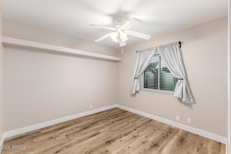 2nd Bedroom – Neutral tones, ceiling fan