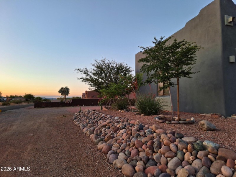 Front side of garage landscaped