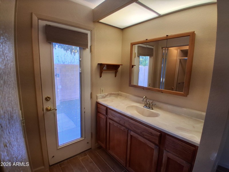 Master Bathroom Vanity and Door to Spa A