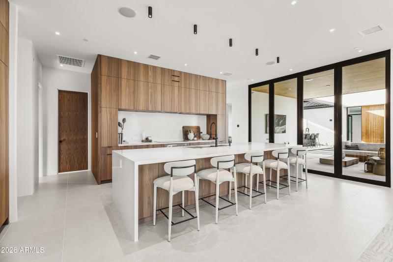 GOURMET KITCHEN + WATERFALL ISLAND