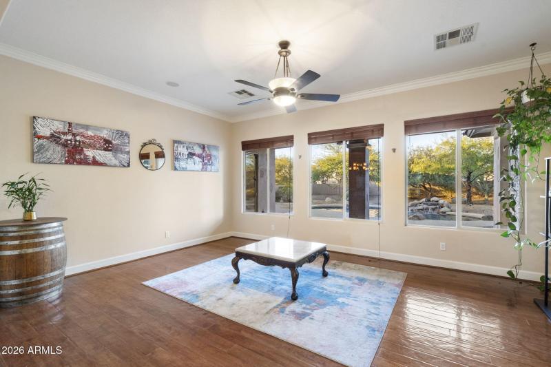 Spacious Living Area w Wood Flooring