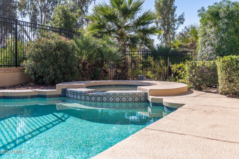 Spa with spillway into the pool