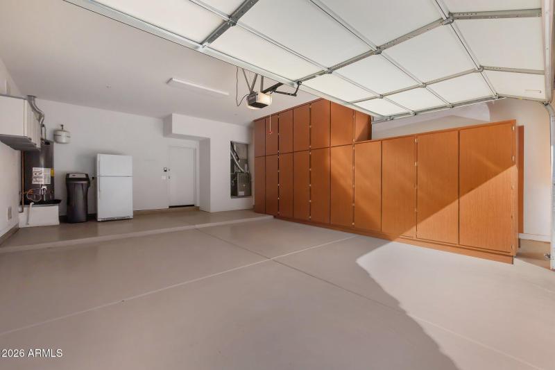 Large 2 car garage with storage cabinets