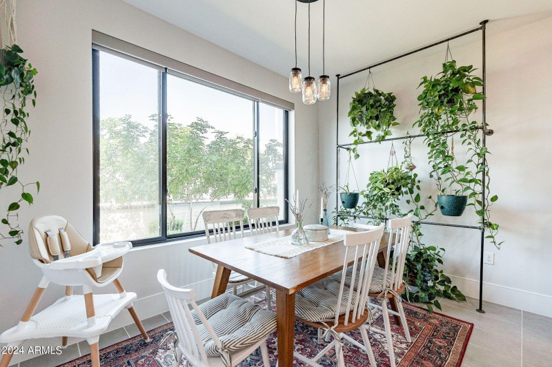 Breakfast room with custom plant wall