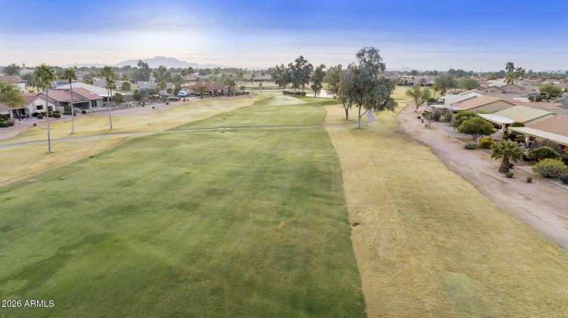 Aerial fairway view along back of home