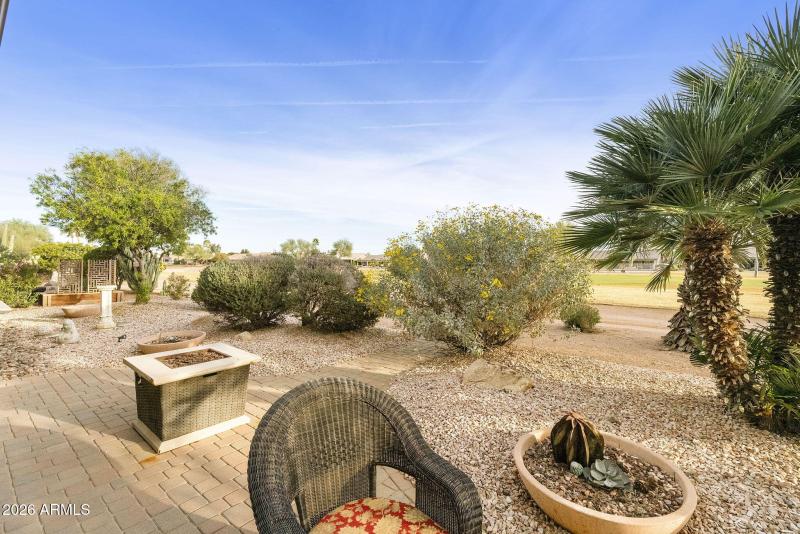 Back patio on golf course with firepit