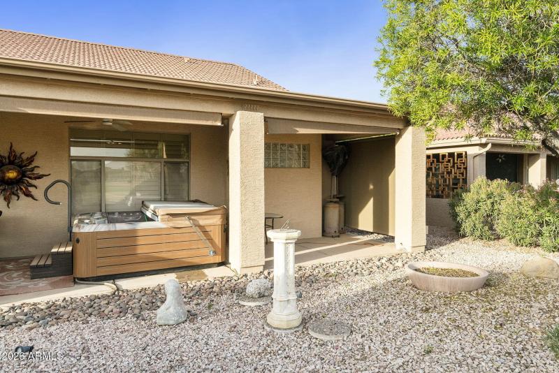 Covered patio with hot tub