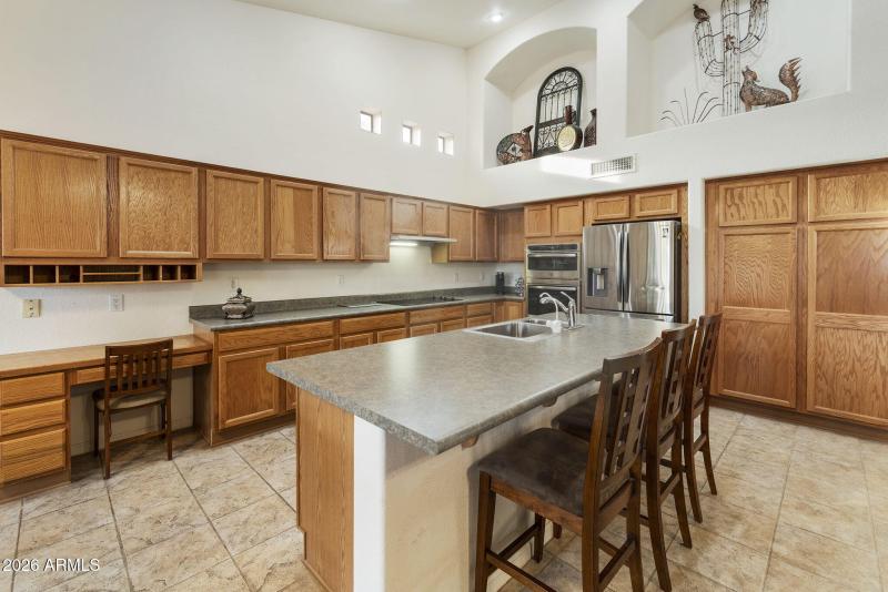 Kitchen with island breakfast bar