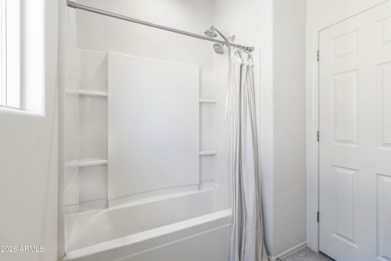 Hall bathroom with tub