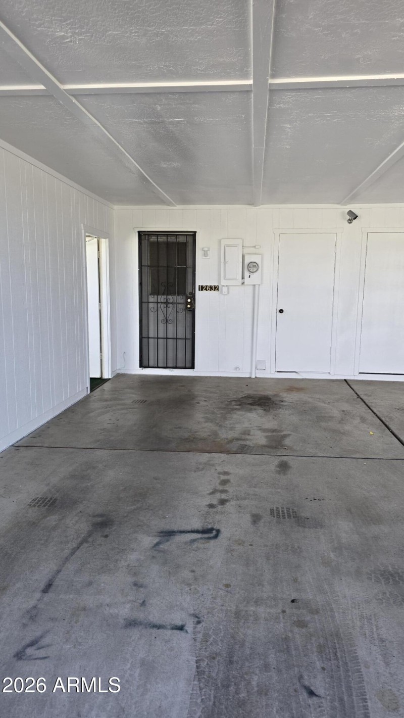 Storage shed off parking area
