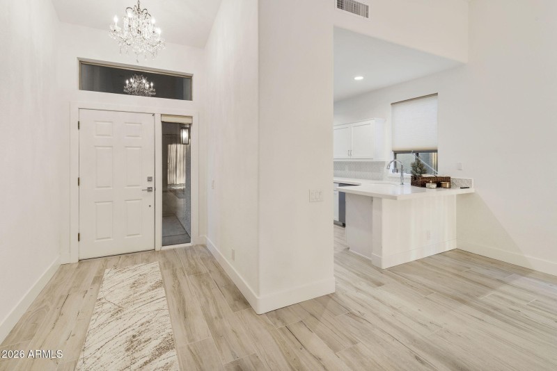 Inside Entry with Kitchen on right