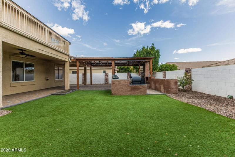 Backyard looking at barbeque area