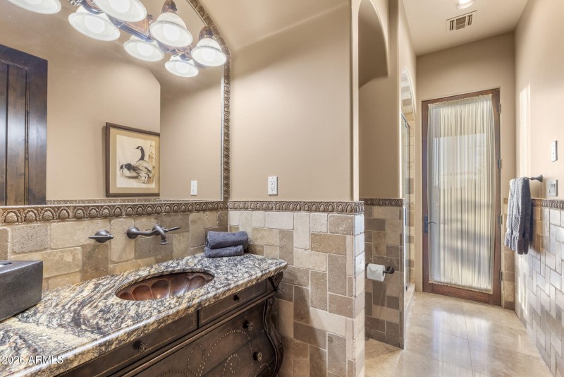 Bathroom with a door to the pool