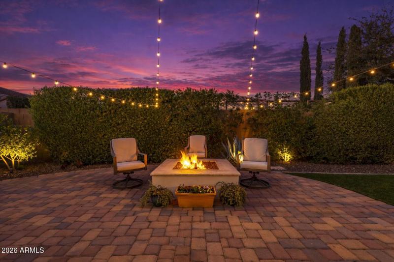 Backyard firepit AI twilight