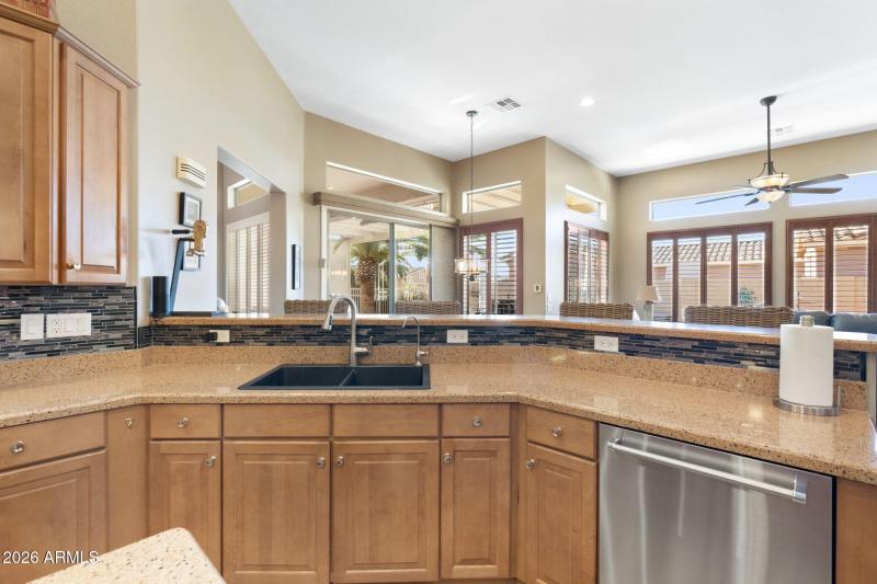 Views from Kitchen to Backyard Oasis