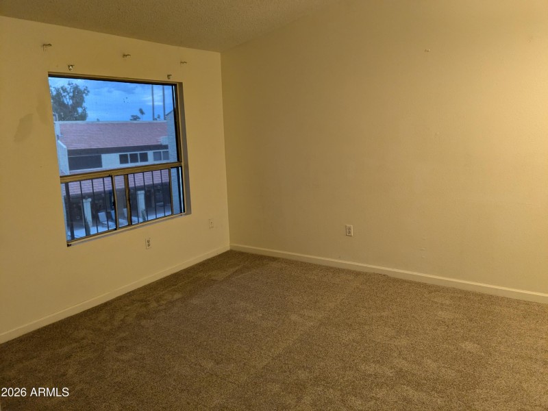 Open living area with larger window.