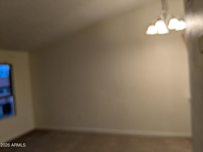 Living area with vaulted ceilings