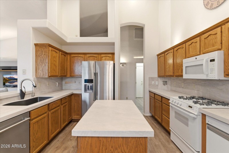 Center Island & Stainless Refrigerator