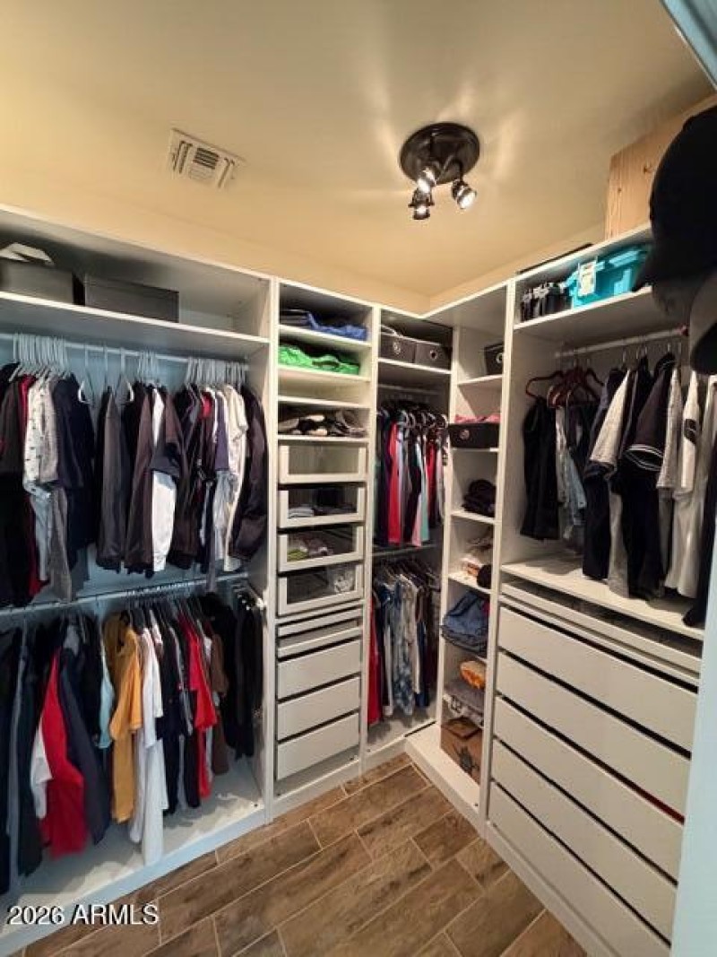 Primary Walk In Customized Closet