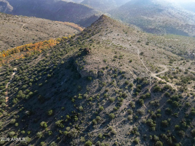 Knoll w shot of trail and road