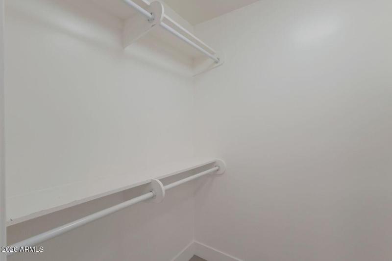 Primary walk-in closet.