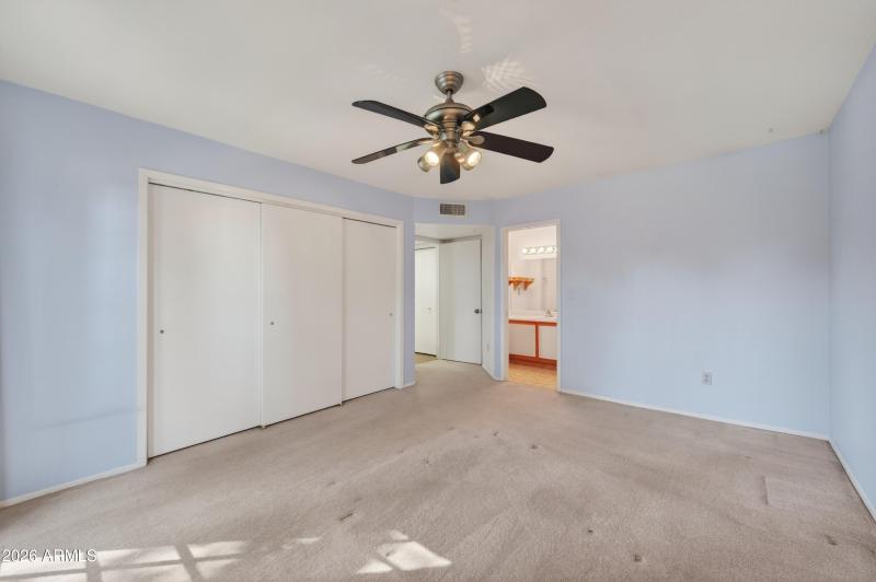 one of two bedrooms with en suite bath